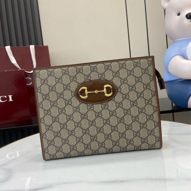 G*u*i clutch bags